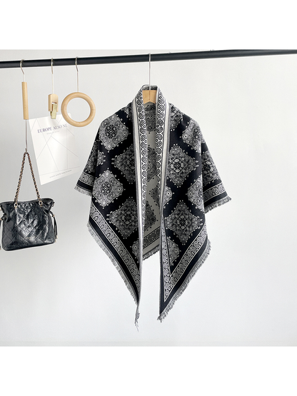 Black medallion-pattern triangle scarf hanging in a full-length front view