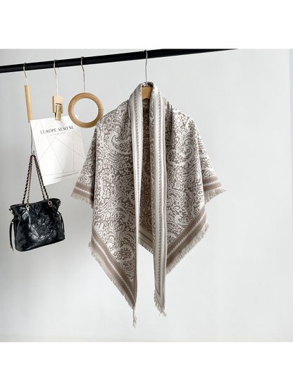 Khaki paisley triangle scarf with contrasting border and short fringe, full hanging view