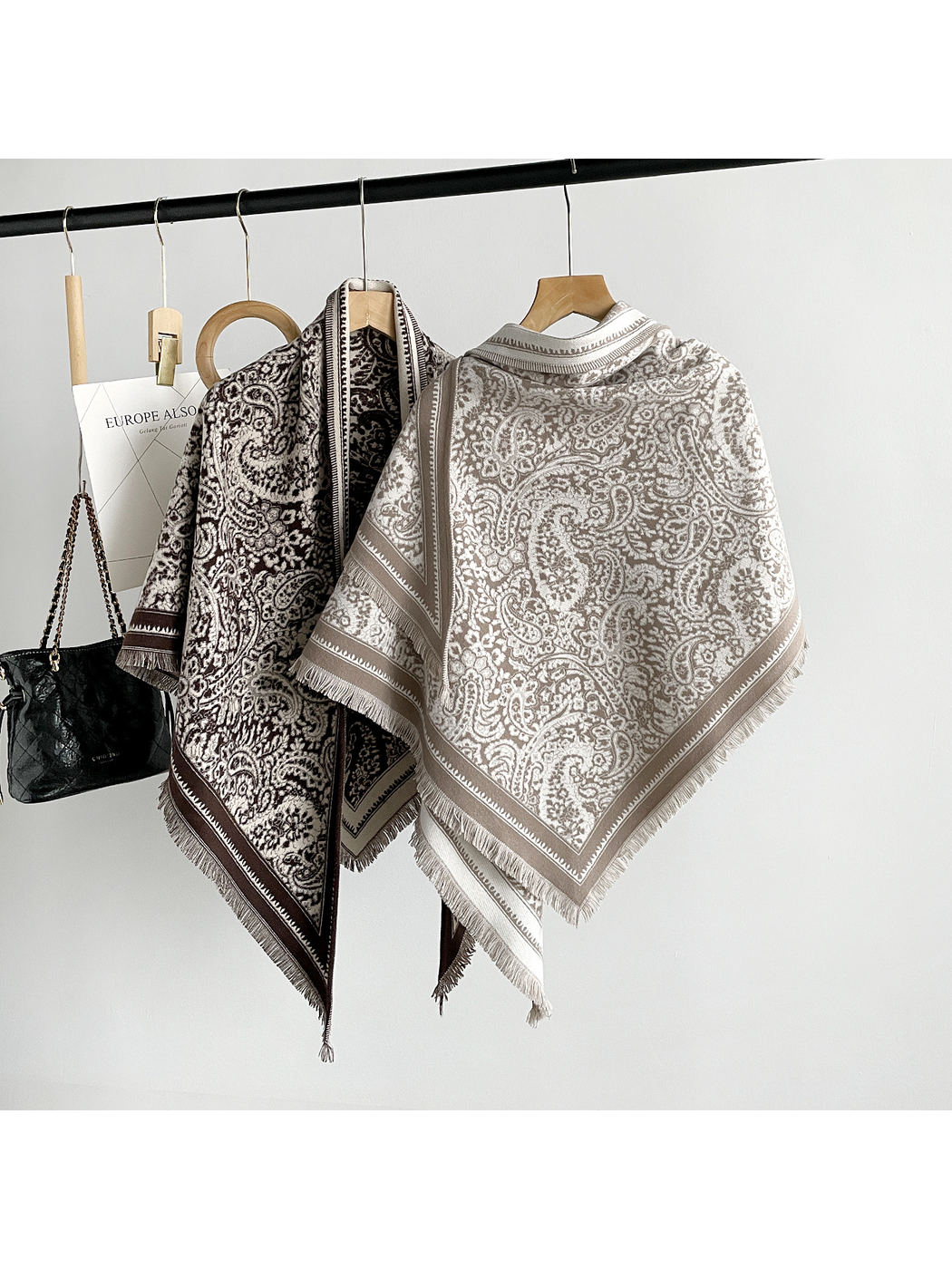 Brown and khaki paisley triangle scarves showing their broad patterned panels