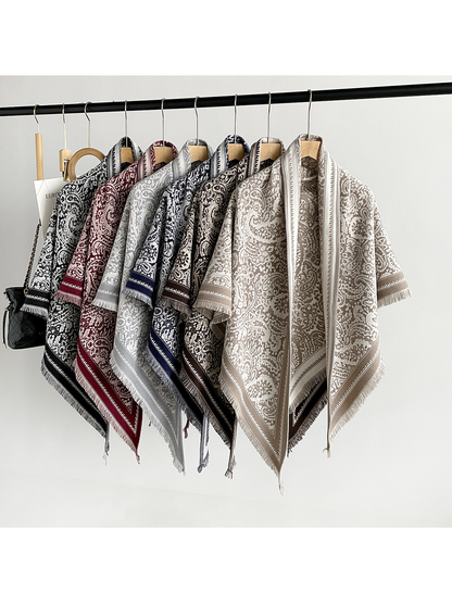 Six paisley triangle scarf colors displayed together on hangers
