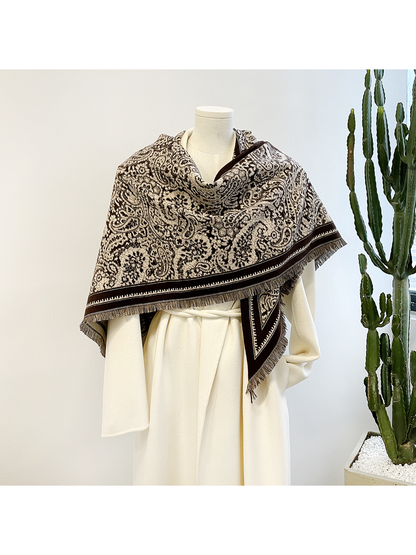 Brown paisley triangle scarf draped over a mannequin
