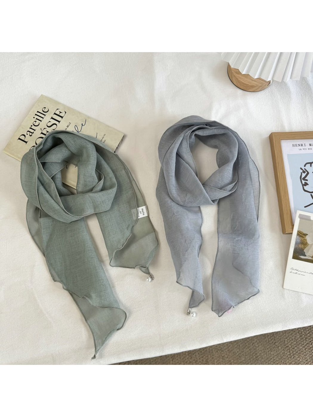 Green and Blue Gray sheer scarves displayed side by side