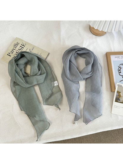 Green and Blue Gray sheer scarves displayed side by side