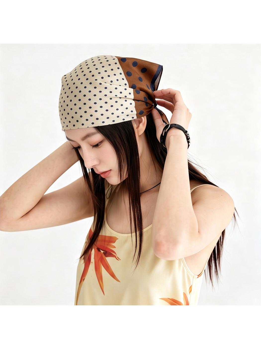 Brown and cream polka dot square scarf styled as a head scarf
