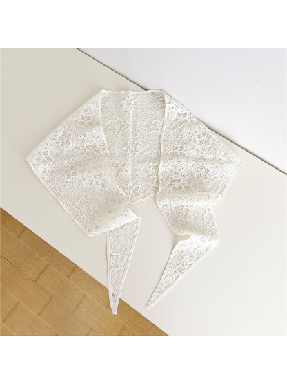 Ivory floral openwork triangle scarf laid open with two tapered tie ends