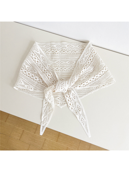 Ivory openwork triangle scarf tied at the front