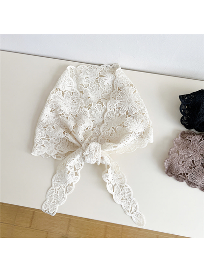 Ivory floral openwork triangle scarf tied at the front