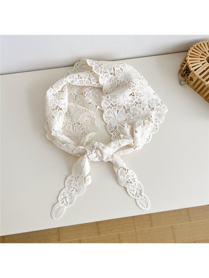 Ivory floral openwork triangle scarf tied at the front