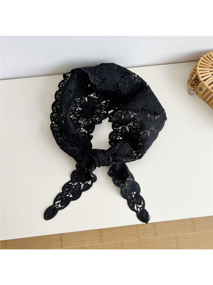 Black floral openwork triangle scarf tied at the front