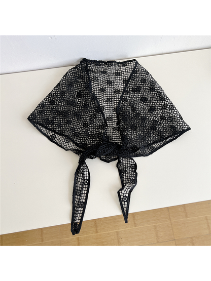 Black openwork triangle scarf tied at the front
