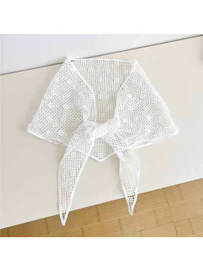 White openwork triangle scarf tied at the front