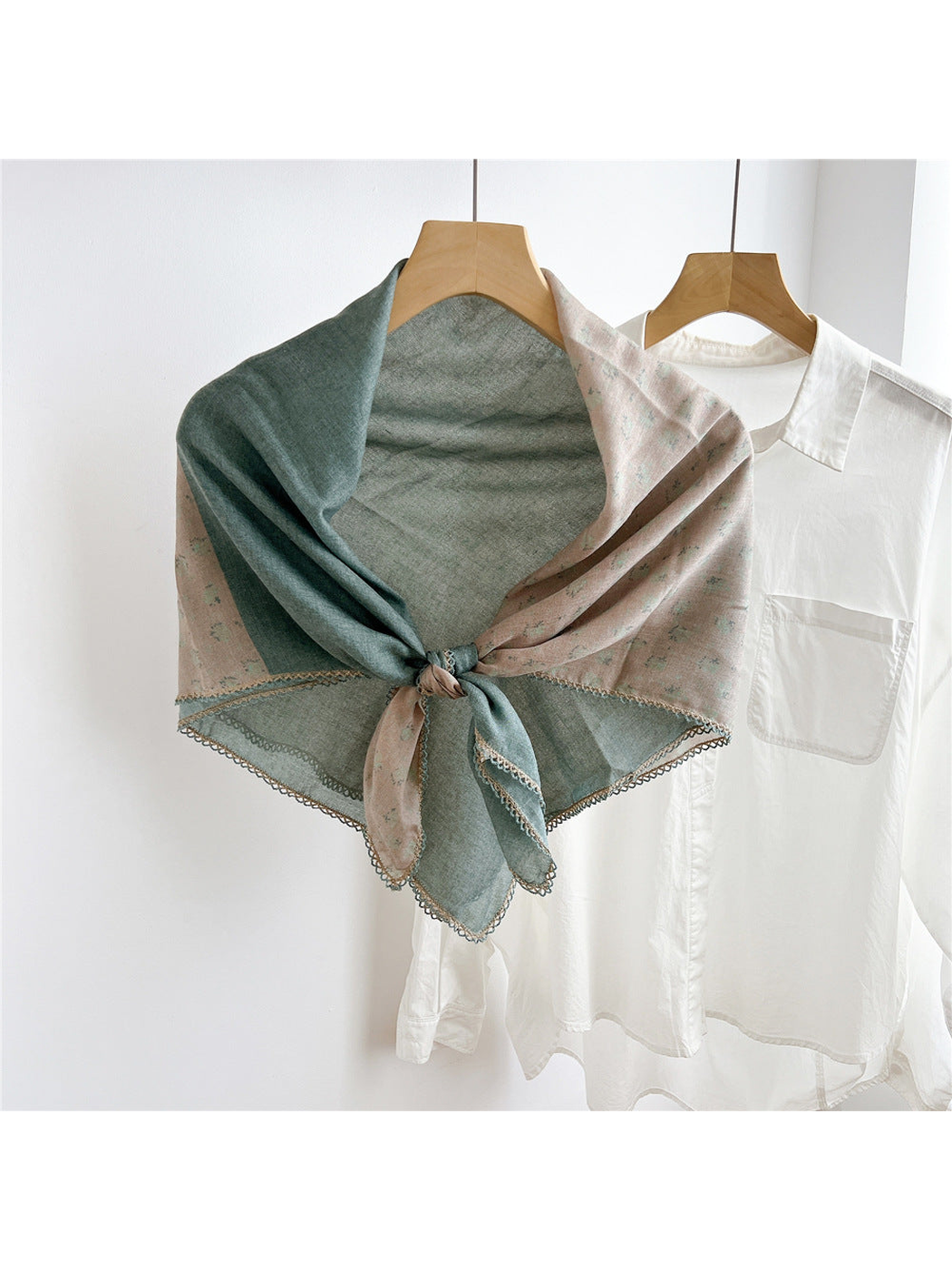 Teal Blue two-tone floral scarf tied on a hanger
