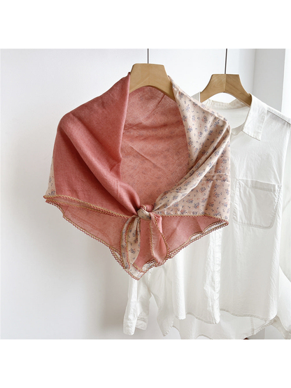 Dusty Pink two-tone floral scarf tied on a hanger