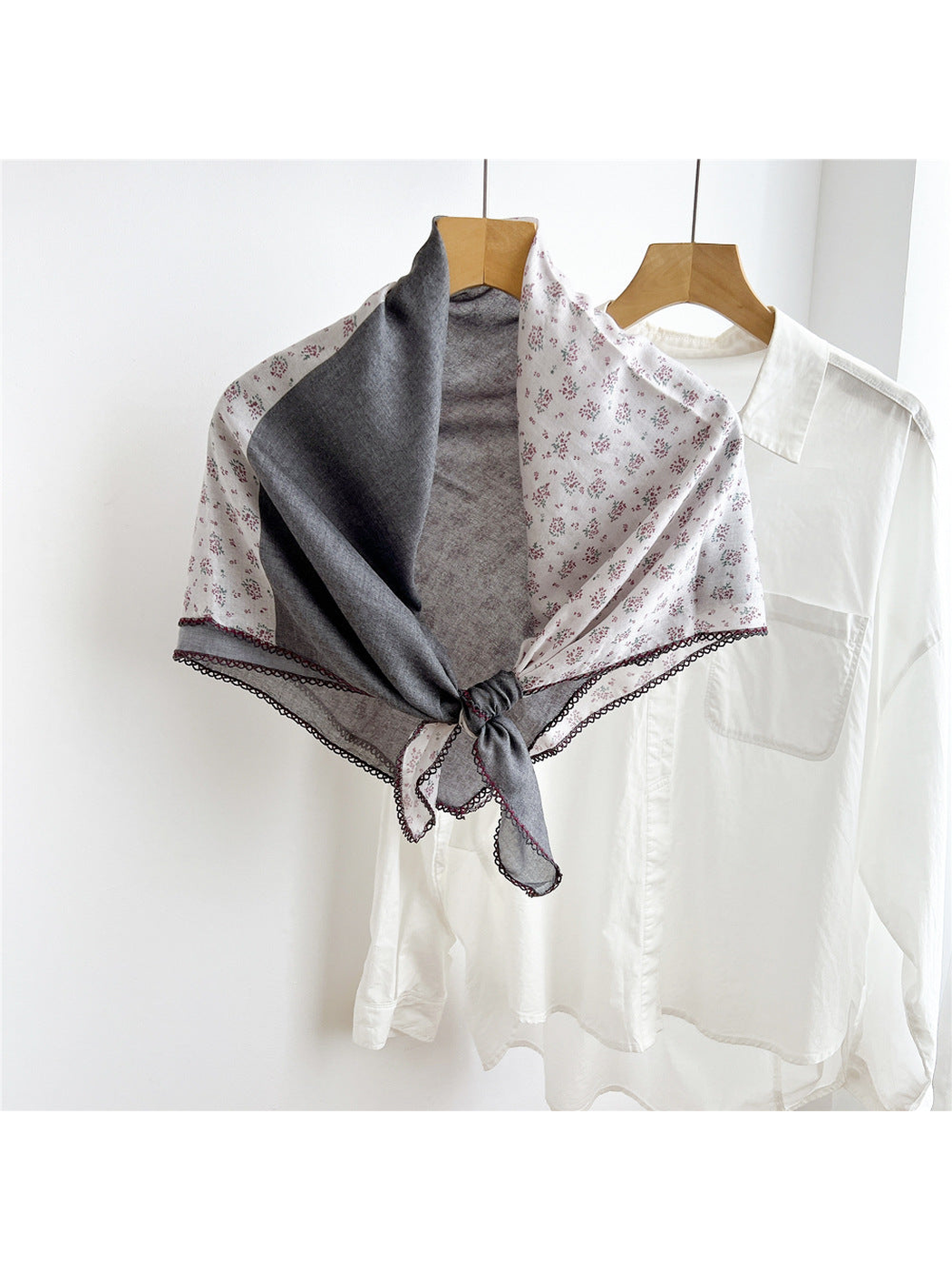 Dark Gray two-tone floral scarf tied on a hanger
