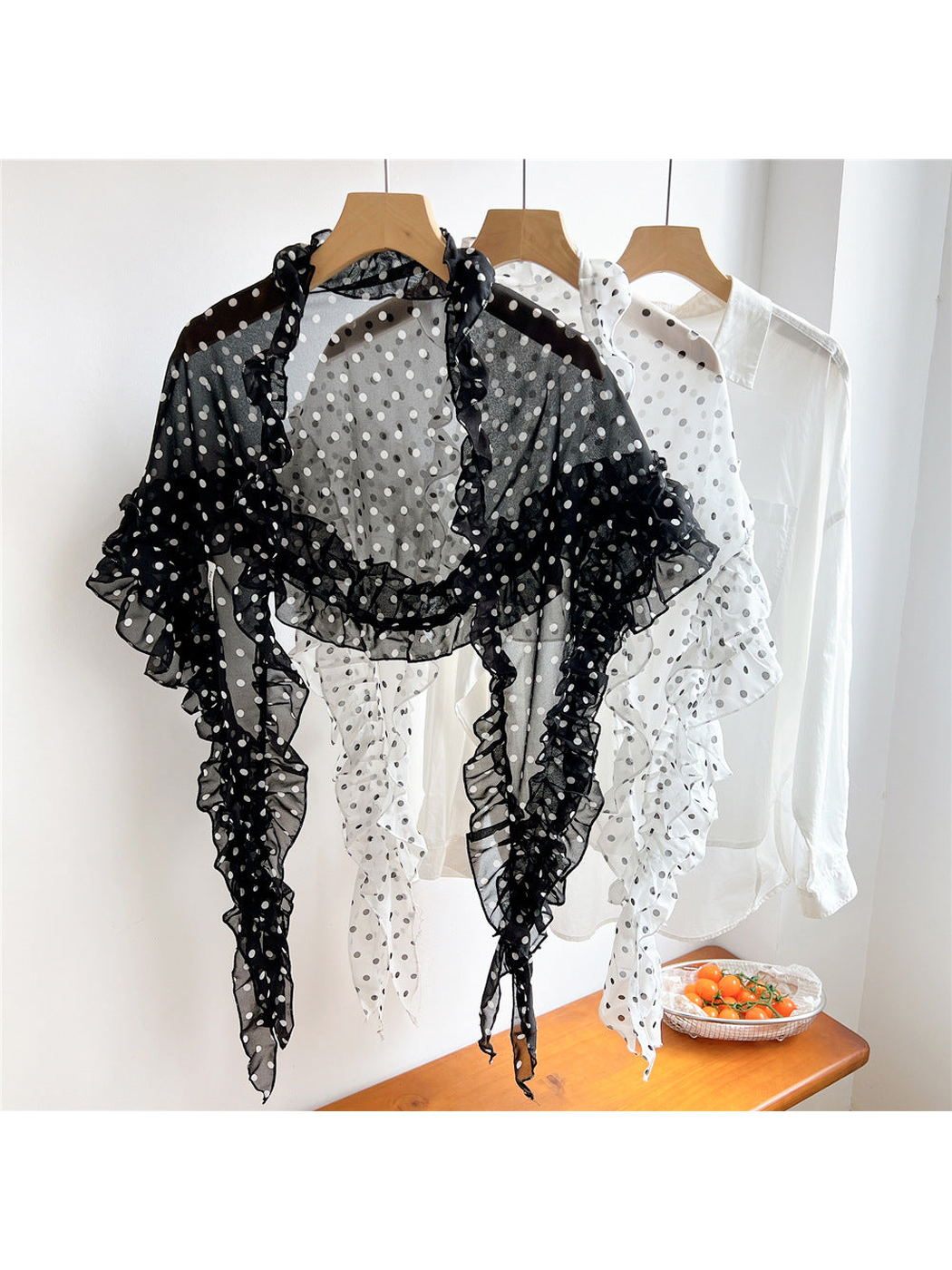 Black and white sheer polka dot triangle scarves displayed together