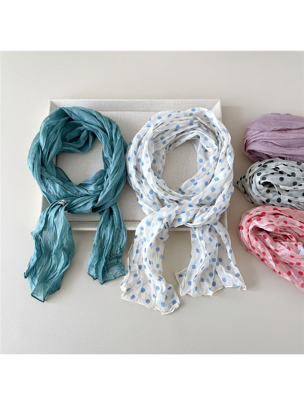 Teal Blue and Blue Dots scarves with additional patterned variations