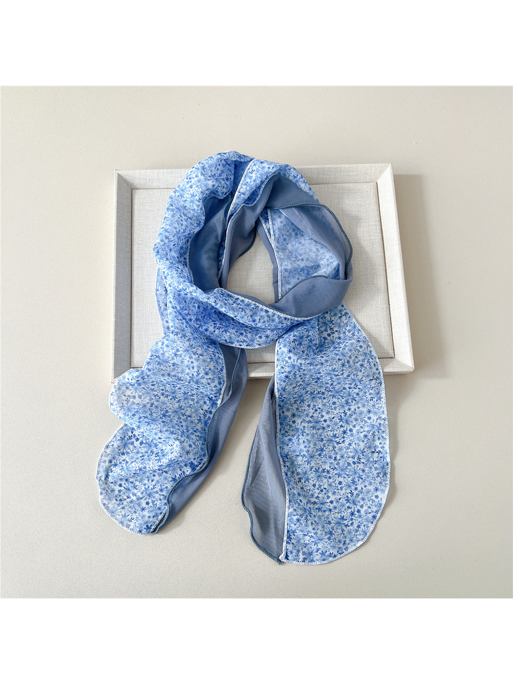 Blue Floral scarf with a dense floral print and blue-gray side panel