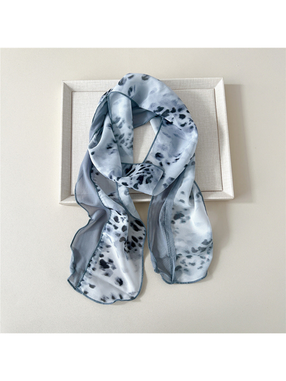Gray Leopard scarf with a gray-and-black animal print and blue-gray side panel