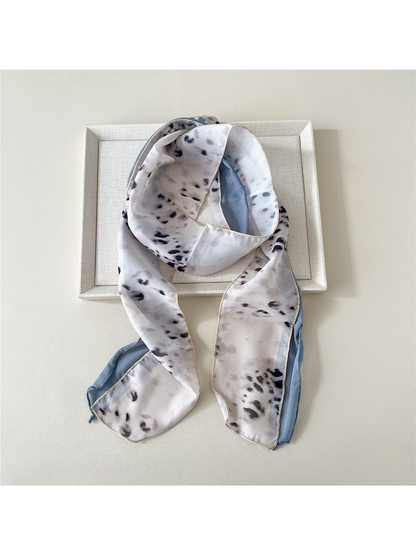 Greige Leopard scarf with a greige-and-black animal print and blue-gray side panel