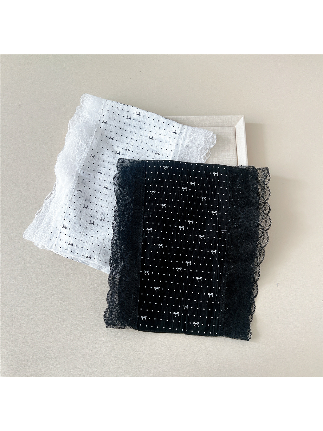 Folded White and Black dotted bow scarves with lace borders