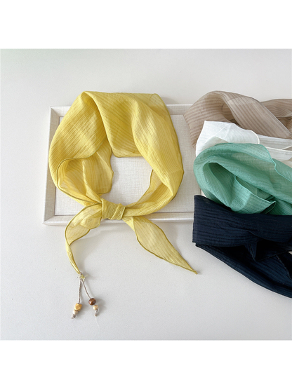 Yellow textured scarf tied beside ivory, mint, navy and beige options