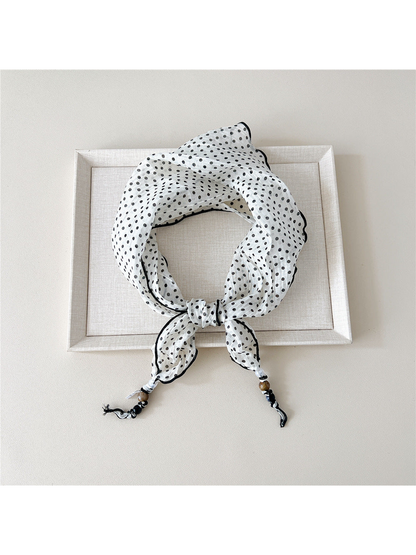 Ivory Dots triangular scarf tied with beaded tips