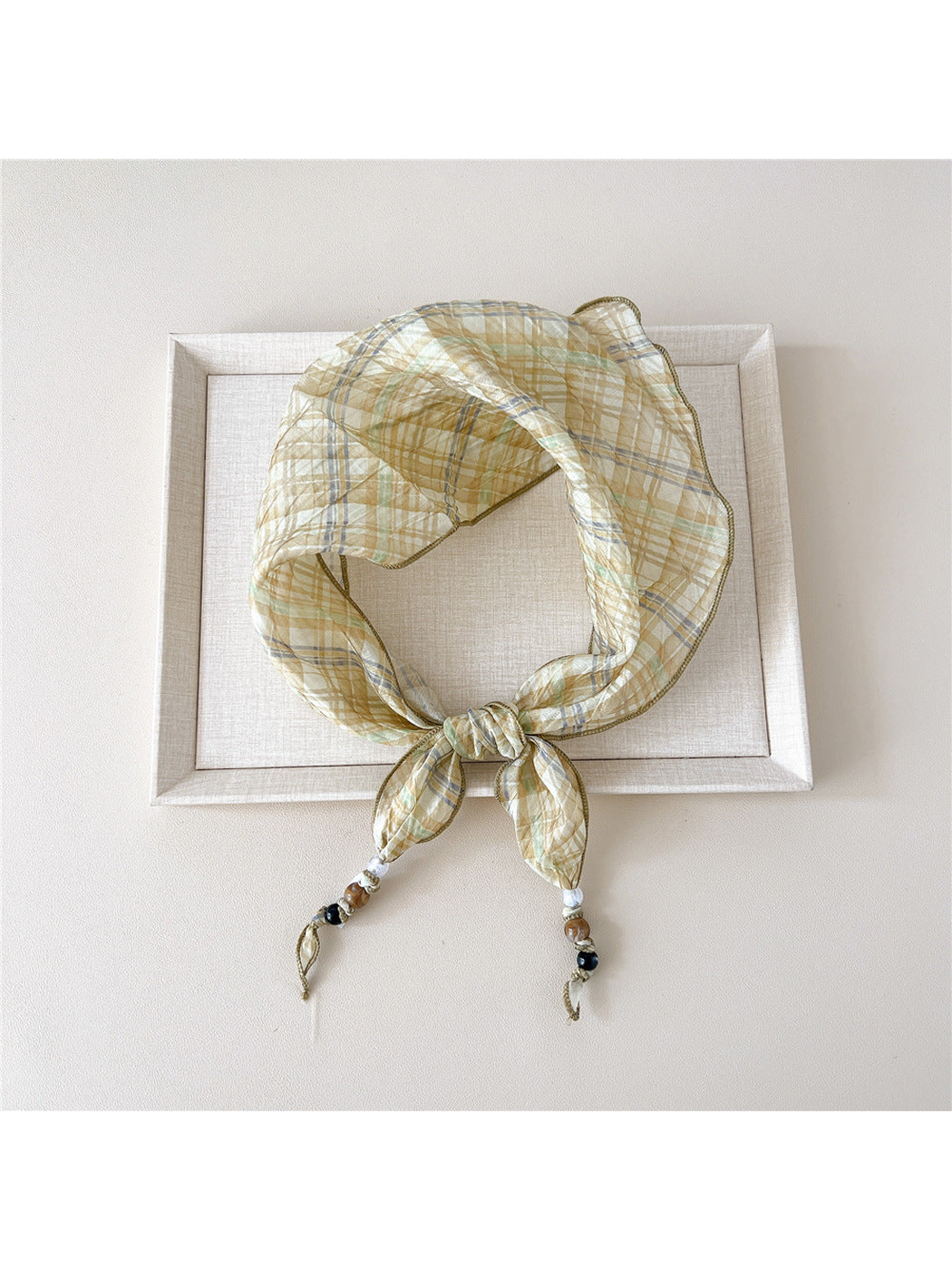 Yellow Plaid triangular scarf tied with beaded tips