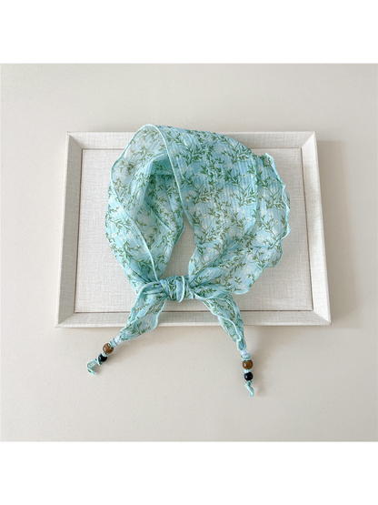 Turquoise Branches triangular scarf tied with beaded tips