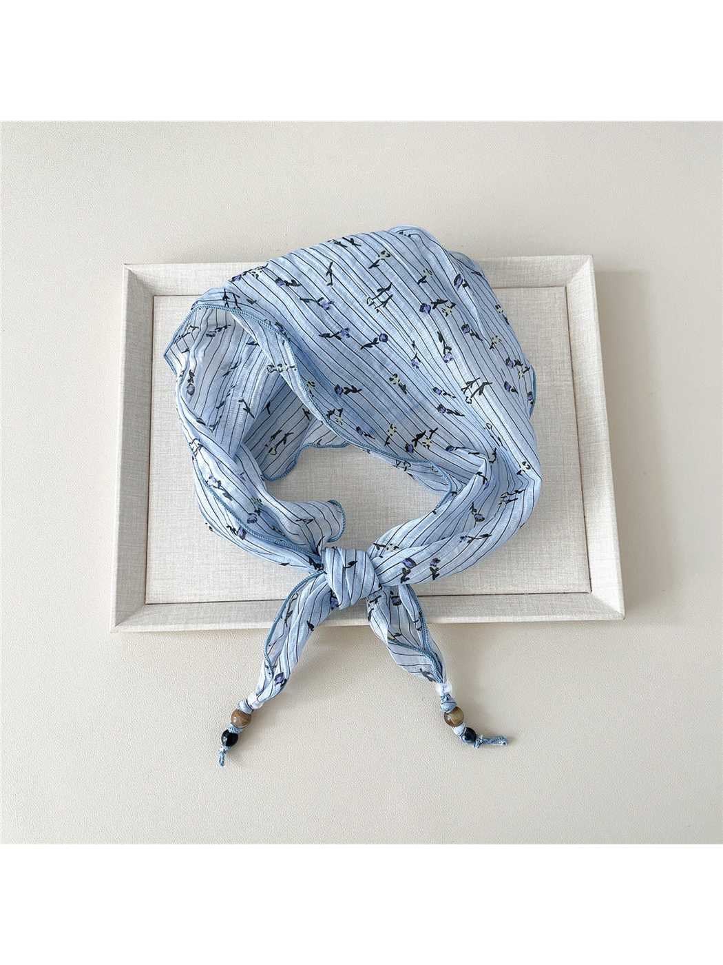Blue Stripes triangular scarf tied with beaded tips