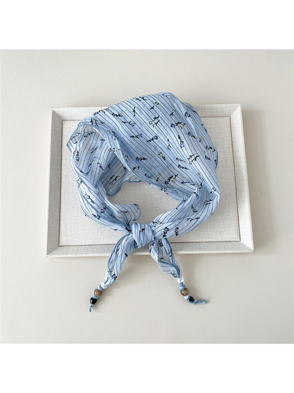 Blue Stripes triangular scarf tied with beaded tips