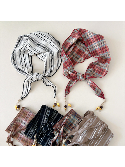 Multiple scarf styles arranged in tied and folded views