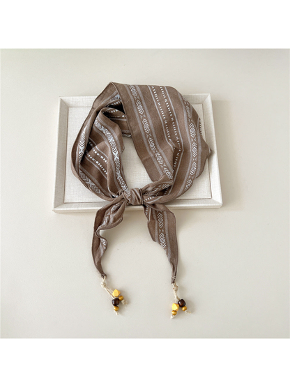 Camel geometric triangle scarf with bead-tipped ends
