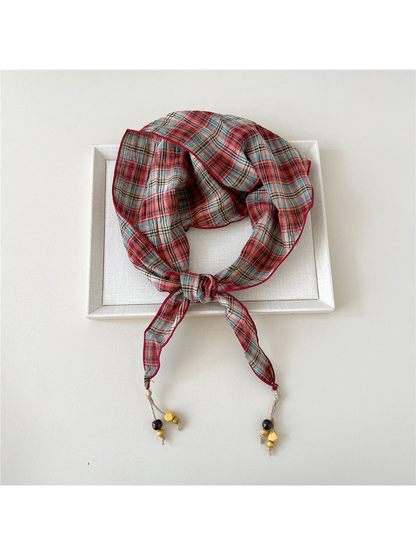 Red plaid triangle scarf with bead-tipped ends
