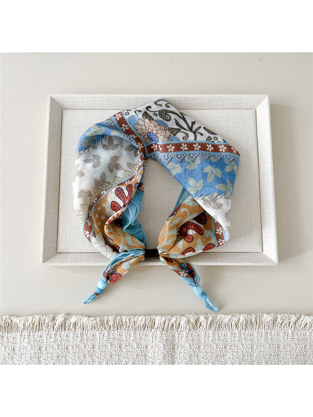 Floral Patchwork scarf-style headband in blue, orange, cream, and brown