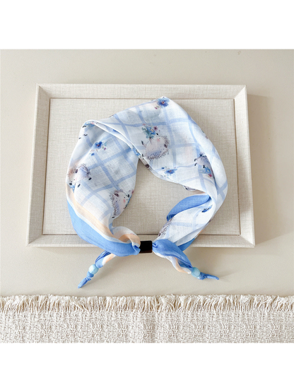 Hedgehog Floral scarf-style headband in pale blue with a plaid pattern