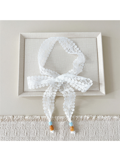 White Leafy Floral skinny scarf tied in a bow with beaded ends
