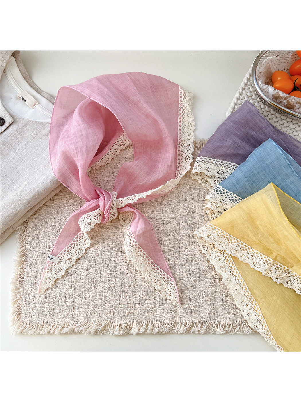 Light Pink triangle scarf displayed with folded color variants