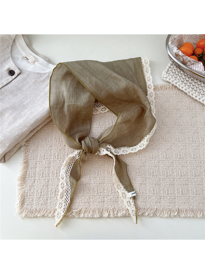 Khaki triangle scarf tied with cream openwork lace trim