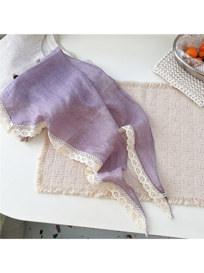 Light Purple triangle scarf laid open to show its pointed shape and cream lace edge