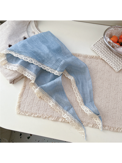 Light Blue triangle scarf laid open with cream openwork lace trim