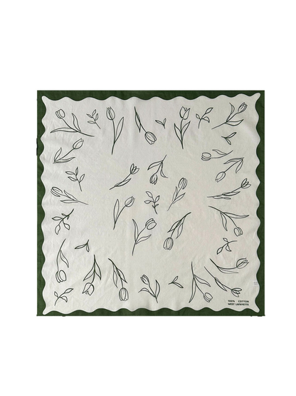 Green square scarf with scattered floral line art and scalloped border