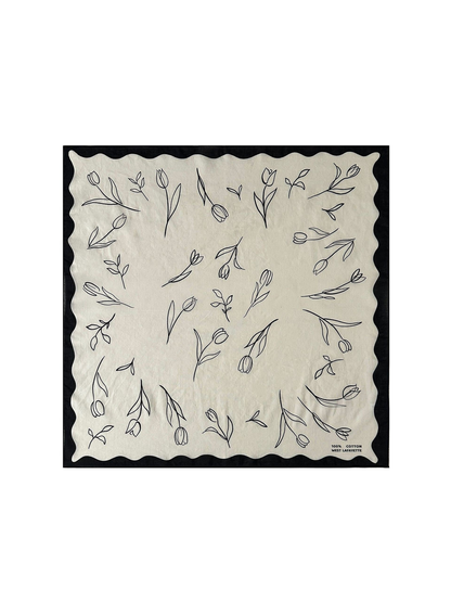 Black square scarf with scattered floral line art and scalloped border