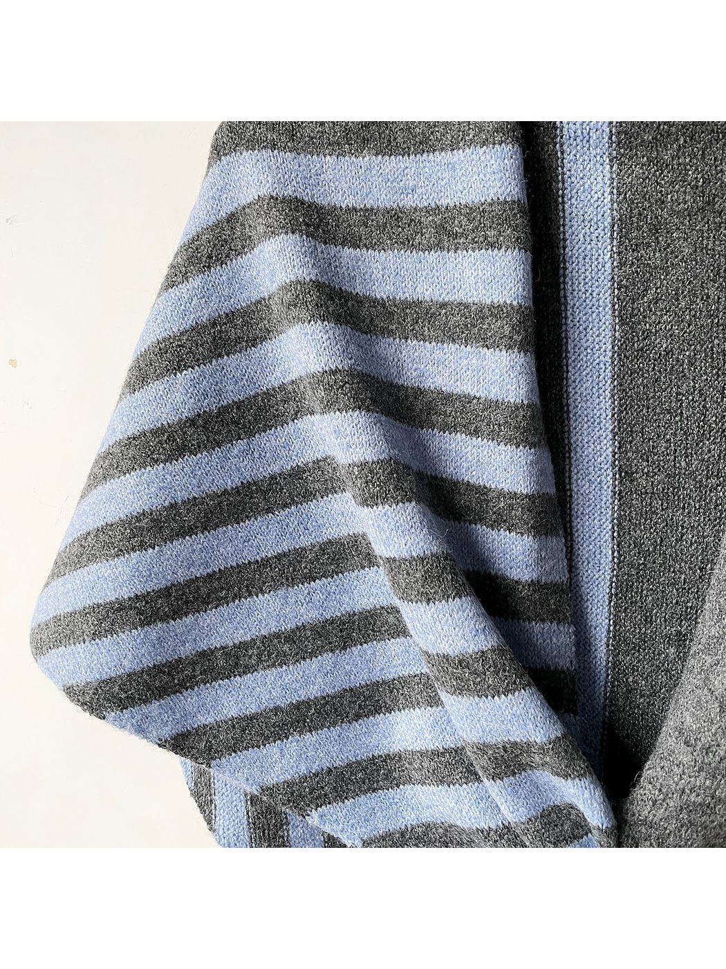Close-up of the Gray Blue scarf's fuzzy striped knit texture