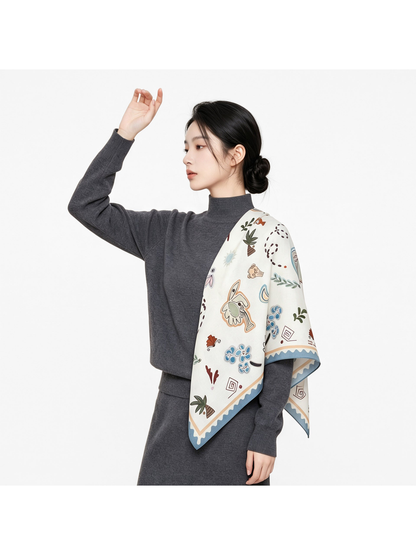 Abstract-print square scarf draped over one shoulder