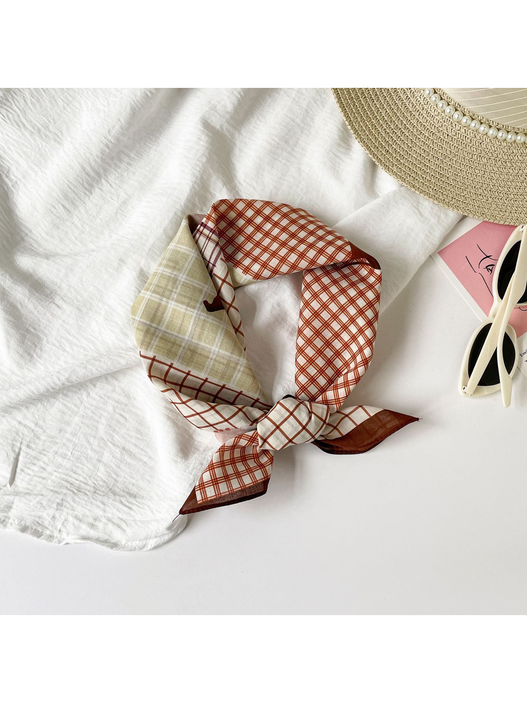 Patchwork plaid square scarf tied in a loose knot
