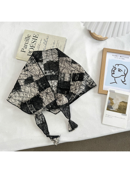 Black abstract mesh scarf with block pattern and pointed ends