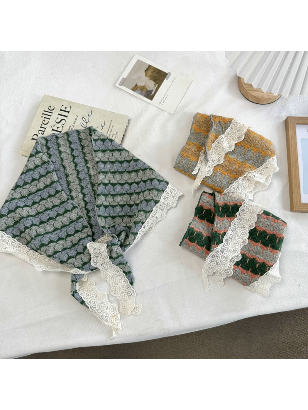 Gray, mustard yellow, and dark green patterned scarves with ivory lace edging