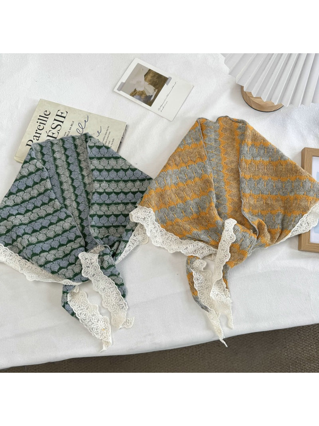 Gray and mustard yellow patterned scarves displayed with ivory lace edging