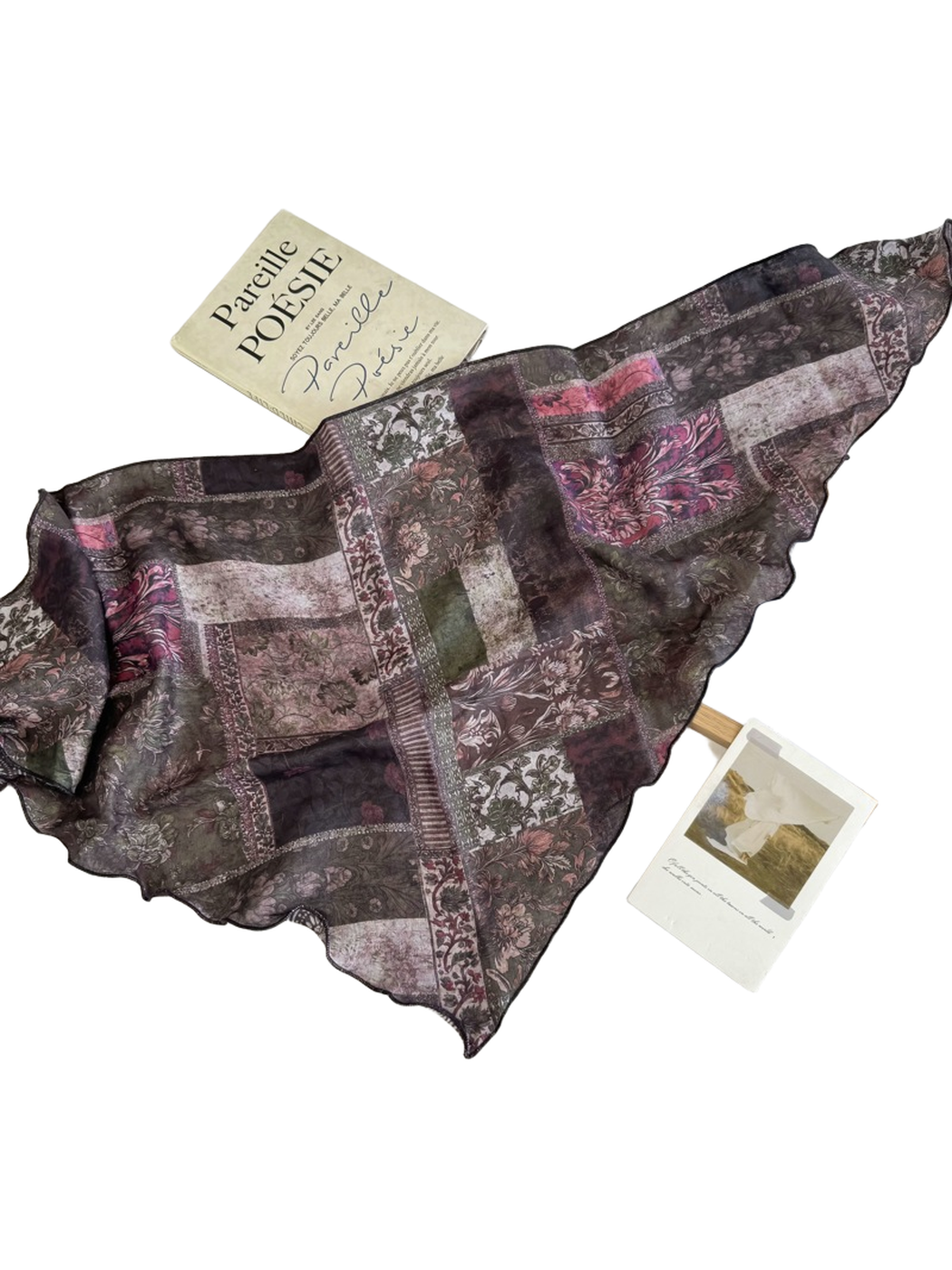 Dark green rectangular scarf with floral patchwork print spread flat