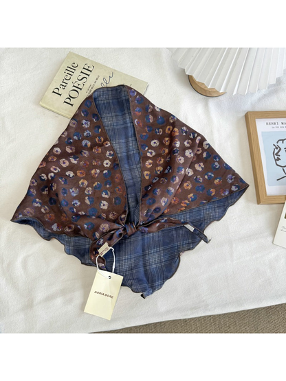 Navy Plaid scarf with small floral print and plaid reverse, tied display